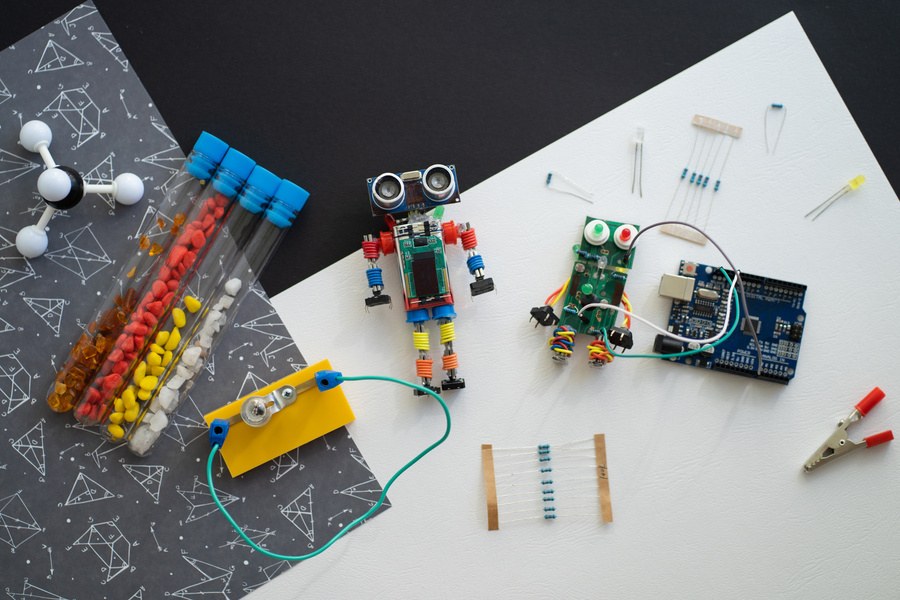 Electronics, motors and robotics components on a worktable